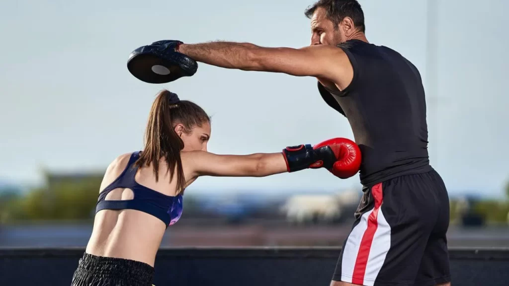 Image-of-a-man-and-a-woman-practicing-punching-outside.