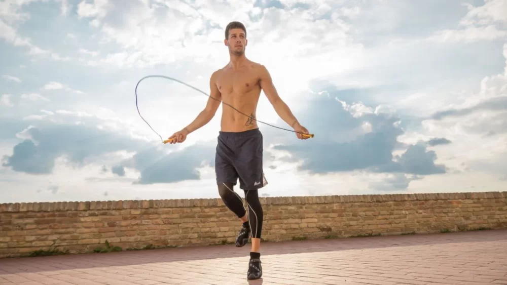 Image-of-a-man-jumping-rope-outside.