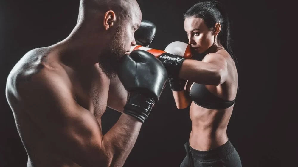 Image-of-a-woman-hitting-a-man-with-a-left-hook-to-the-face