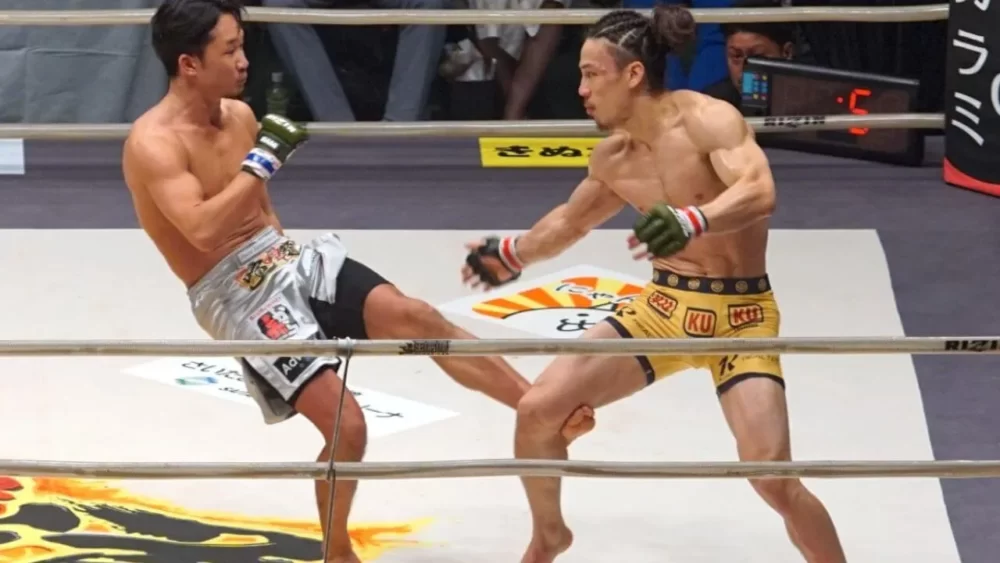 Image-of-Mikuru-Asakura-kicking-a-calf-kick-in-a-match