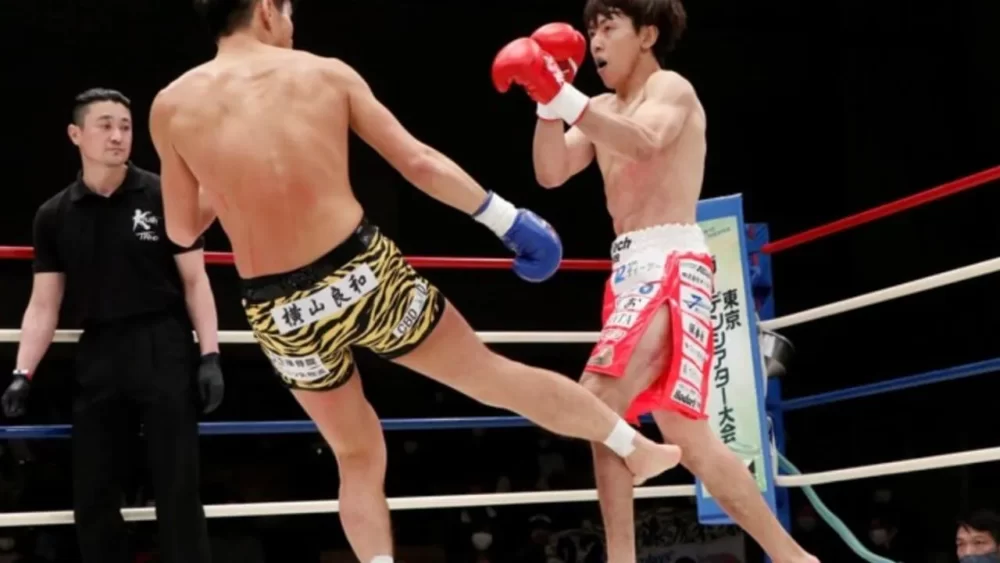 Image-of-a-man-being-kicked-in-the-calf-in-a-kickboxing-match