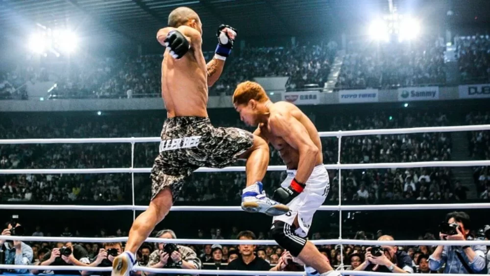 Image-of-Kid-Yamamoto-doing-a-knee-kick-in-a-match