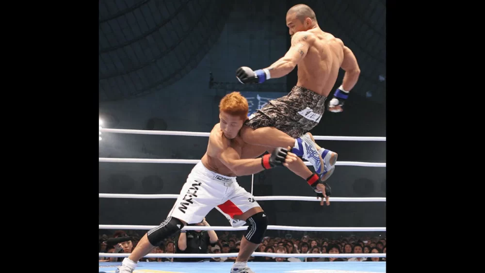 Image-of-Kido-Yamamoto-doing-a-flying-knee-kick-in-a-match