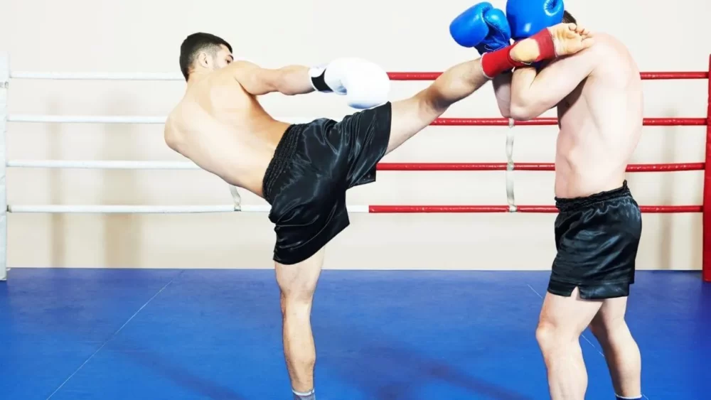 Image-of-a-man-doing-a-high-kick-to-the-head-of-his-opponent.